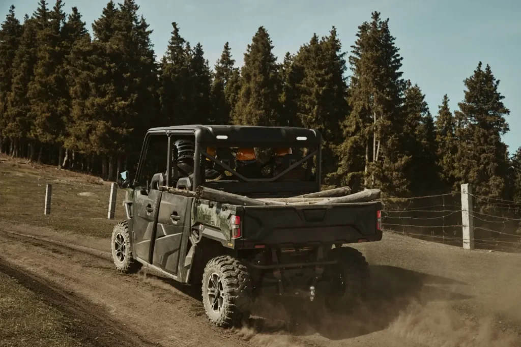 UWolf 1000L carrying logs in the cargo bed